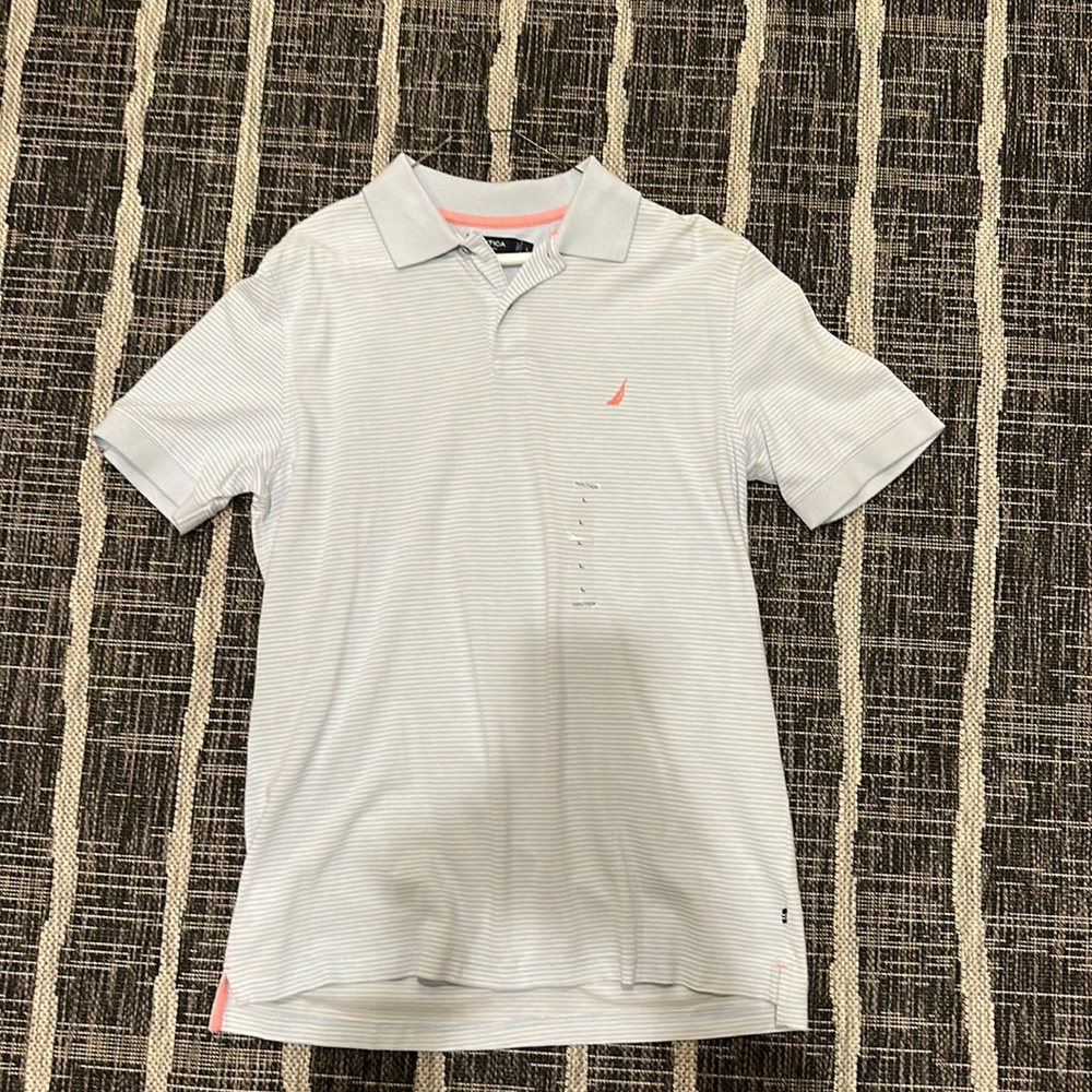 NAUTICA light blue and white striped new with tags polo shirt.